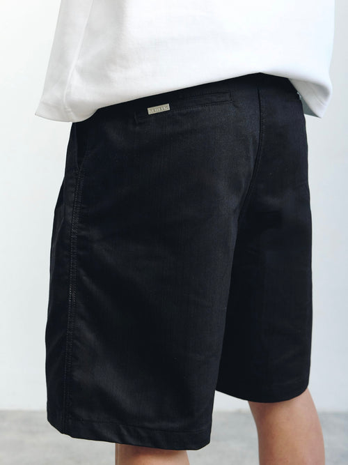 Black pleated shorts